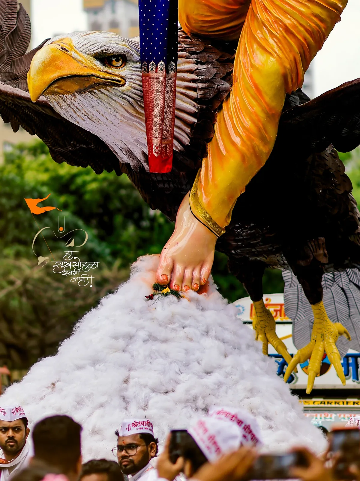 Bappa's foot resting on Garuda above the cotton cloud
