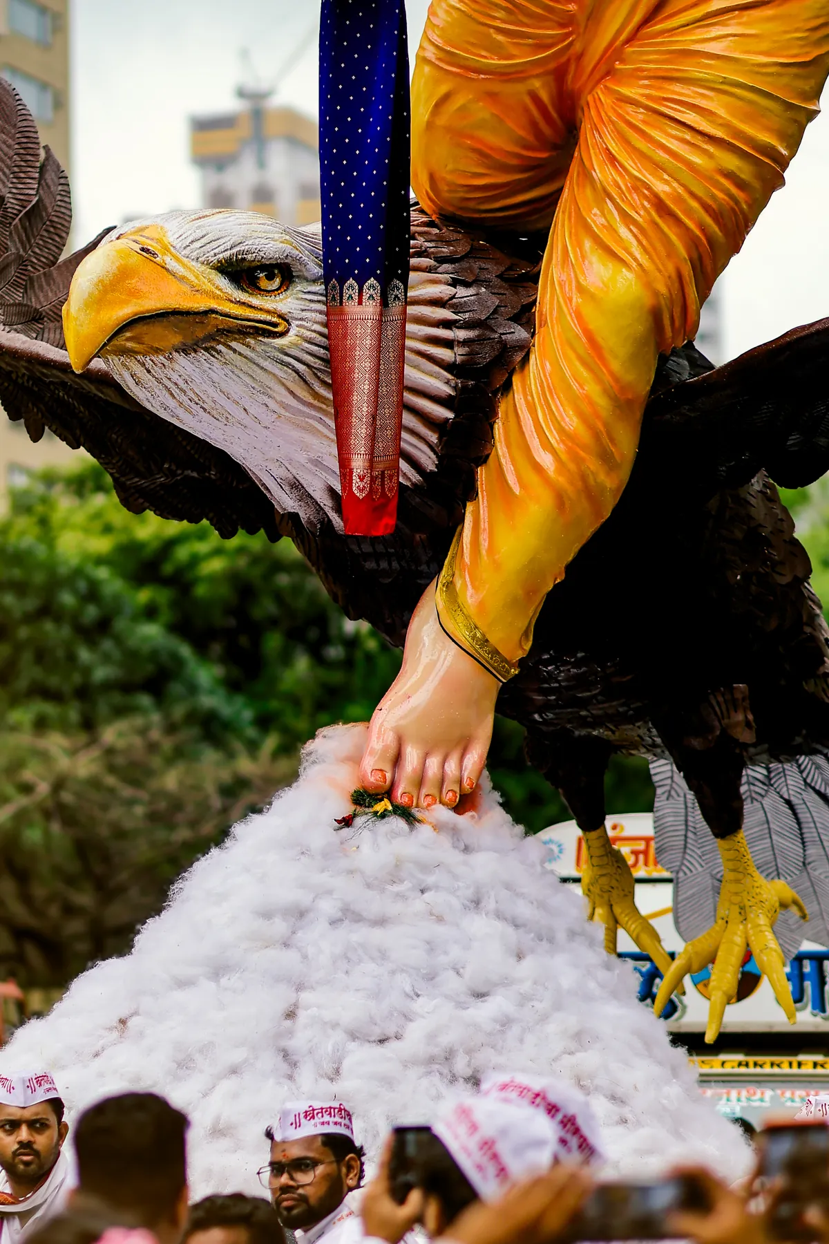 Bappa's foot resting on Garuda's back above the cotton cloud